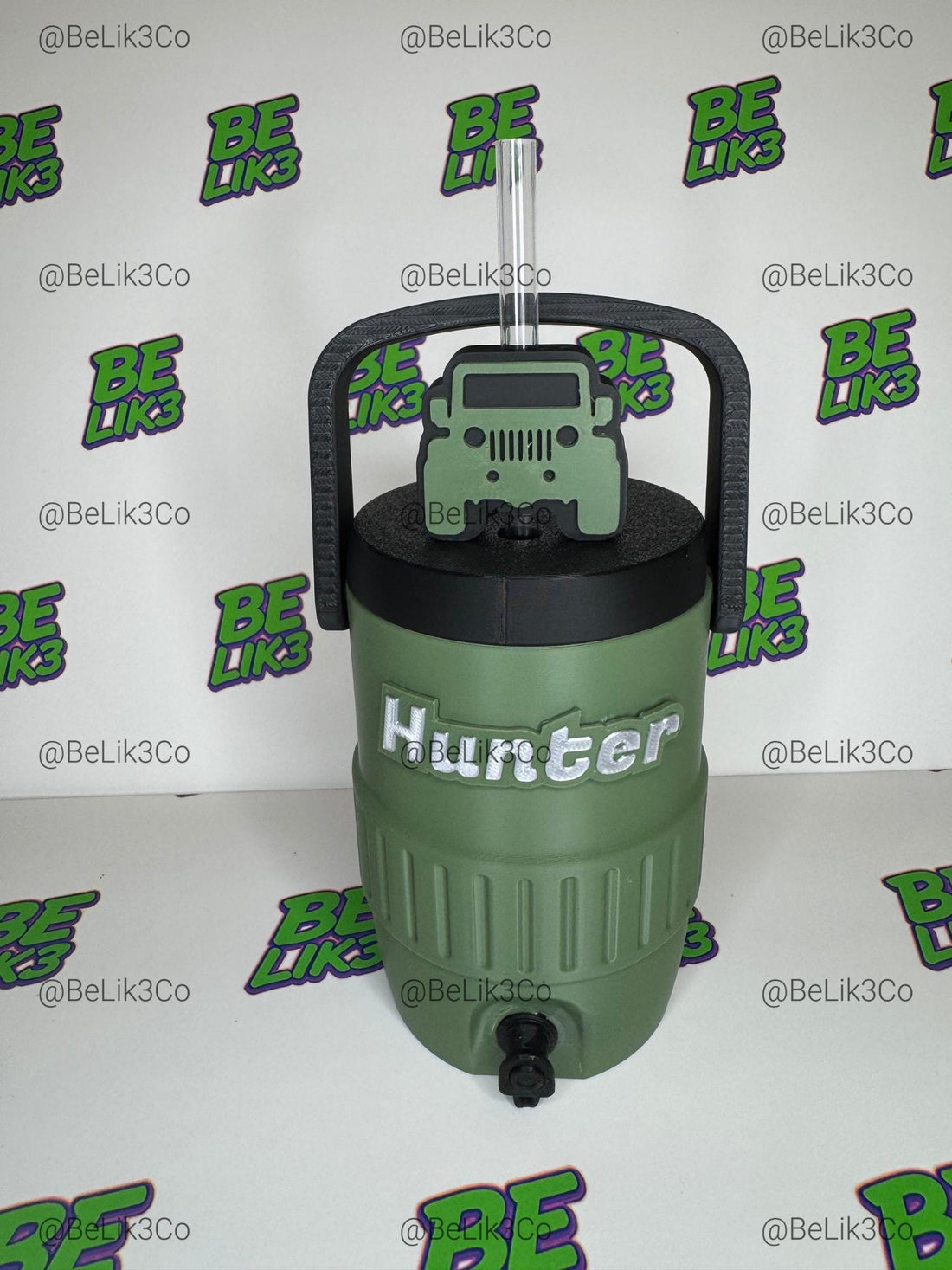 May include: A sage green plastic beverage cooler with a black lid and handle, featuring a sage green Jeep-shaped straw topper on a clear straw. The text JEEP STRAW TOPPER is visible on the right, and the text @BE LIK3 is visible on the bottom left.